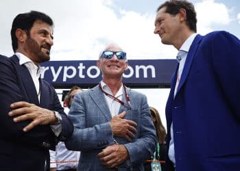 MIAMI, FLORIDA - MAY 08: Mohammed ben Sulayem, FIA President, Liberty Media boss Greg Maffei and Ferrari Chairman John Elkann talk on the grid during the F1 Grand Prix of Miami at the Miami International Autodrome on May 08, 2022 in Miami, Florida. (Photo by Jared C. Tilton/Getty Images)