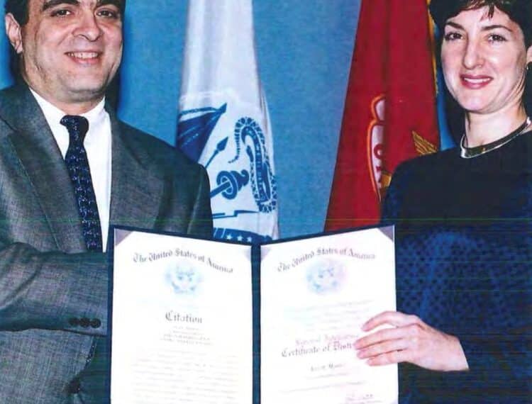 An undated handout image from a U.S. Department of Defense report dating back to 2005 shows Ana Belen Montes receiving a national intelligence certificate of distinction from George Tenet, who served as Director of Central Intelligence (DCI) for the United States Central Intelligence Agency. U.S. Department of Defense/Handout via REUTERS    THIS IMAGE HAS BEEN SUPPLIED BY A THIRD PARTY