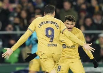 Barcelona's Robert Lewandowski, left, celebrates with his teammate Pedri after scoring his side's second goal during a Spanish La Liga soccer match between Real Betis and Barcelona at the Benito Villamarin stadium in Seville, Spain, Wednesday, Feb. 1, 2023. (AP Photo/Jose Breton)