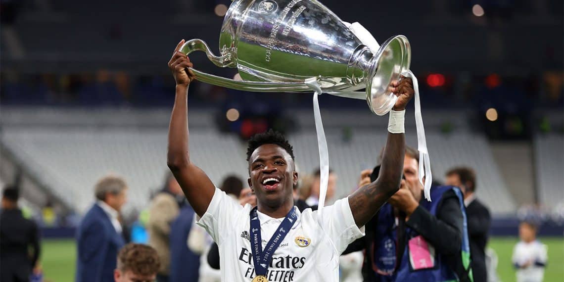 PARIS, FRANCE - MAY 28: Vinicius Junior of Real Madrid celebrates with the UEFA Champions League Trophy after their sides victory in the UEFA Champions League final match between Liverpool FC and Real Madrid at Stade de France on May 28, 2022 in Paris, France. (Photo by Catherine Ivill/Getty Images)