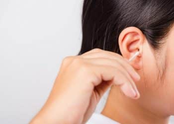 Asian beautiful woman cleaning ear hrt using cotton swab on white background with copy spece for text,  healthcare concept,Image: 506773108, License: Royalty-free, Restrictions: , Model Release: yes, Credit line: Sorapop Udomsri / Panthermedia / Profimedia