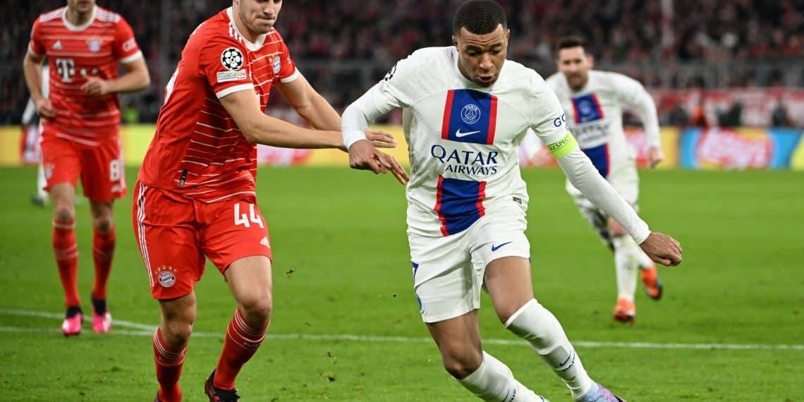 Soccer Football - Champions League - Round of 16 - Second Leg - Bayern Munich v Paris St Germain - Allianz Arena, Munich, Germany - March 8, 2023  Paris St Germain's Kylian Mbappe in action with Bayern Munich's Josip Stanisic REUTERS/Angelika Warmuth