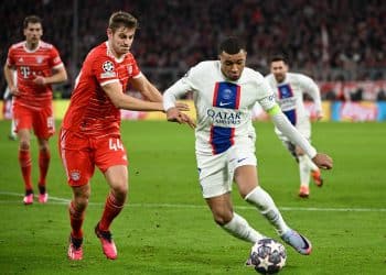 Soccer Football - Champions League - Round of 16 - Second Leg - Bayern Munich v Paris St Germain - Allianz Arena, Munich, Germany - March 8, 2023  Paris St Germain's Kylian Mbappe in action with Bayern Munich's Josip Stanisic REUTERS/Angelika Warmuth