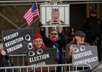 Protesters gather outside the District Attorney's office after a message was posted on the Truth Social account of former U.S. President Donald Trump stating that he expects to be arrested on Tuesday, and called on his supporters to protest, in New York City, U.S. March 21, 2023. REUTERS/Andrew Kelly