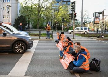 Activists of the "Letzte Generation" (Last Generation) block a road to protest for climate councils, speed limit on highways as well as for affordable public transport, in Berlin, Germany, April 24, 2023. REUTERS/Annegret Hilse