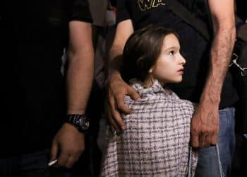 A child looks on as Jordanian citizens and other nationals who were evacuated from Sudan, arrive at Marka Military Airport, in Amman, Jordan April 24, 2023. REUTERS/Alaa Al Sukhni     TPX IMAGES OF THE DAY