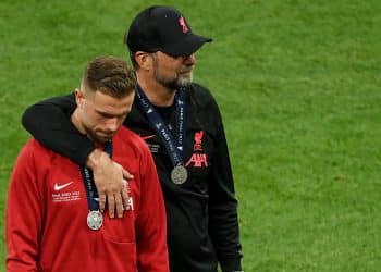 PARIS, FRANCE - MAY 28: Juergen Klopp embraces Jordan Henderson of Liverpool after their sides defeat in the UEFA Champions League final match between Liverpool FC and Real Madrid at Stade de France on May 28, 2022 in Paris, France. (Photo by Matthias Hangst/Getty Images)