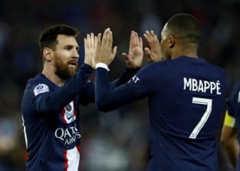 Soccer Football - Ligue 1 - Paris St Germain v RC Lens - Parc des Princes, Paris, France - April 15, 2023  Paris St Germain's Lionel Messi celebrates scoring their third goal with Kylian Mbappe REUTERS/Gonzalo Fuentes