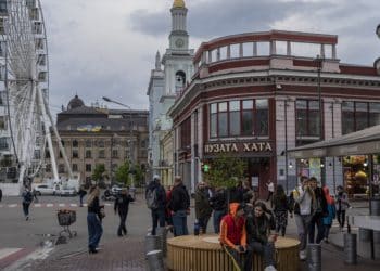 Pedestrians in downtown Kyiv, Thursday, May 4, 2023. Ukraine's capital, Kyiv was the target of an air attack for the third time in four days — once Thursday morning, then a second time at night. Two defensive missiles streaked across the evening sky, and a loud explosion was heard. (AP Photo/Bernat Armangue)