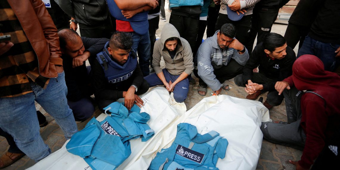 Palestinians mourn local journalists Hassouna Sleem and Sary Mansour, who were killed in an Israeli strike on a house, at a hospital in the central Gaza Strip November 19, 2023. REUTERS/Stringer